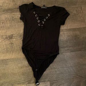 Small black bodysuit, lace up low dip front